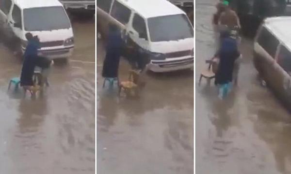 وُصِف بالزوج الأكثر مثالية.. شاهد: ماذا فعل زوج ليُجنب زوجته الابتلال من مياه الأمطار (فيديو)