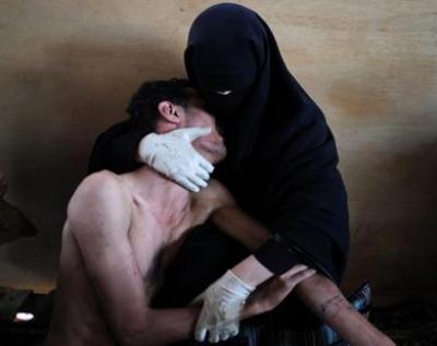 صورة يمنية تفوز بجائزة أفضل صورة عالميا و المحكّمون قالوا إنها تجسيد للربيع العربي كله
