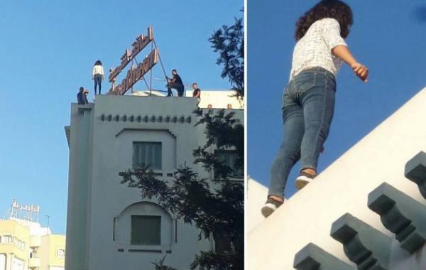 فيديو: فتاة تونسية تحاول الانتحار بالقفز من أعلى بناية شاهقة .. شاهد ما حدث لها في اللحظة الأخيرة!