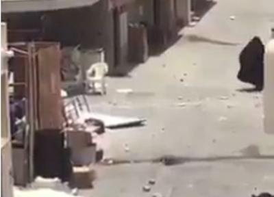 شاهد بالفيديو : إمرأة بحرينية ترد على جنود الأمن روحوا اليمن شوفوا الحوثيين شو يسوون فيكم يا جبناء
